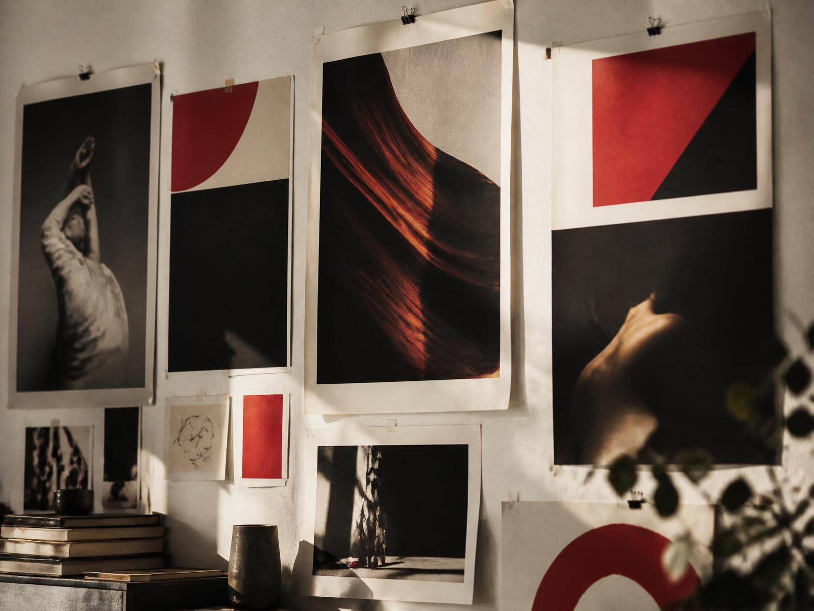 Campaign posters pinned across a creative agency studio wall